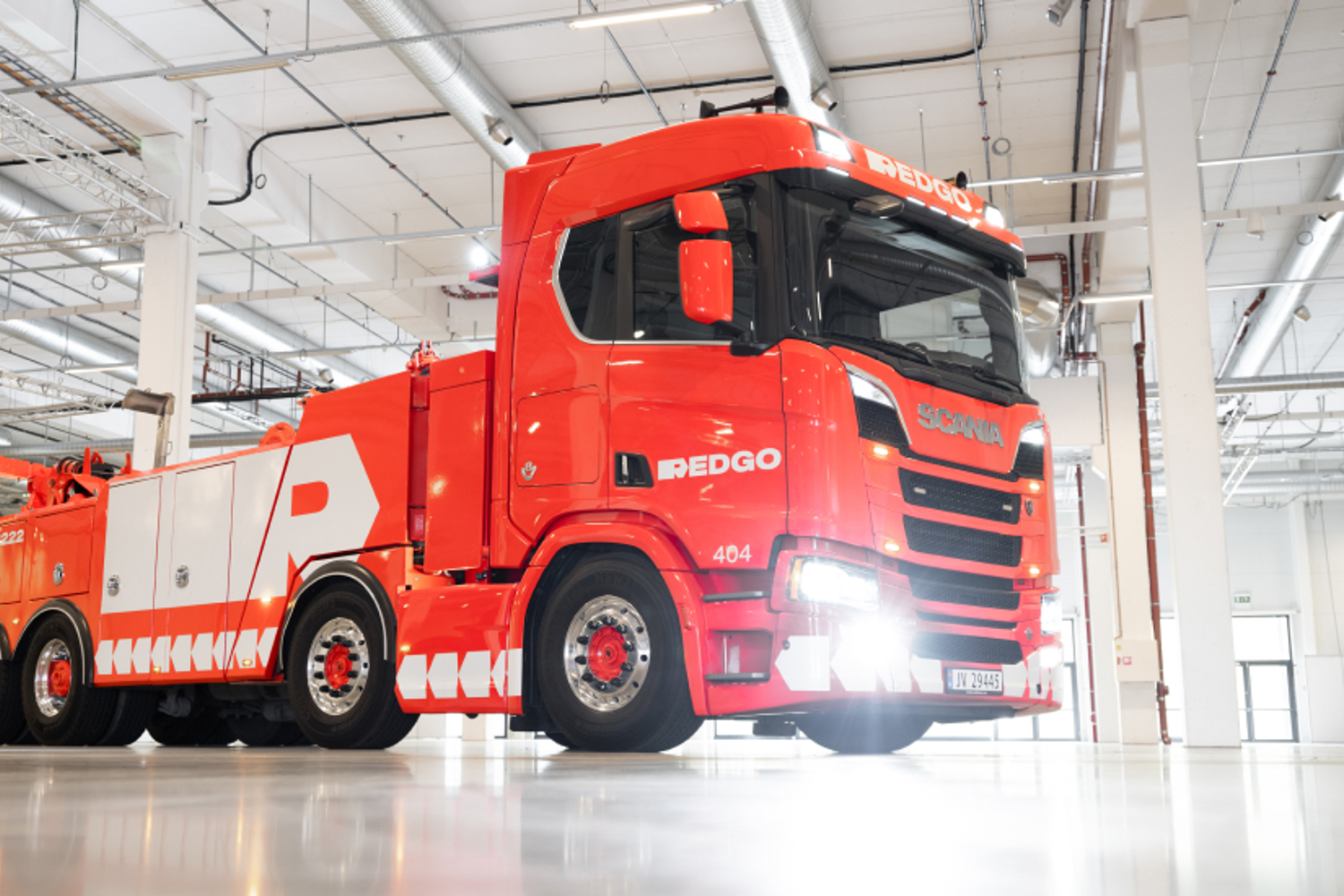 REDGO towing truck in a garage