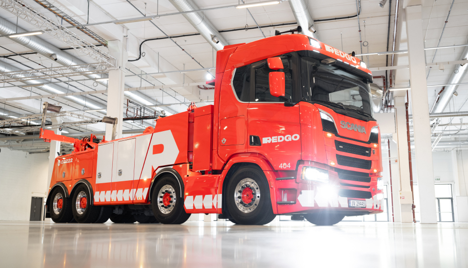 REDGO towing truck in a garage