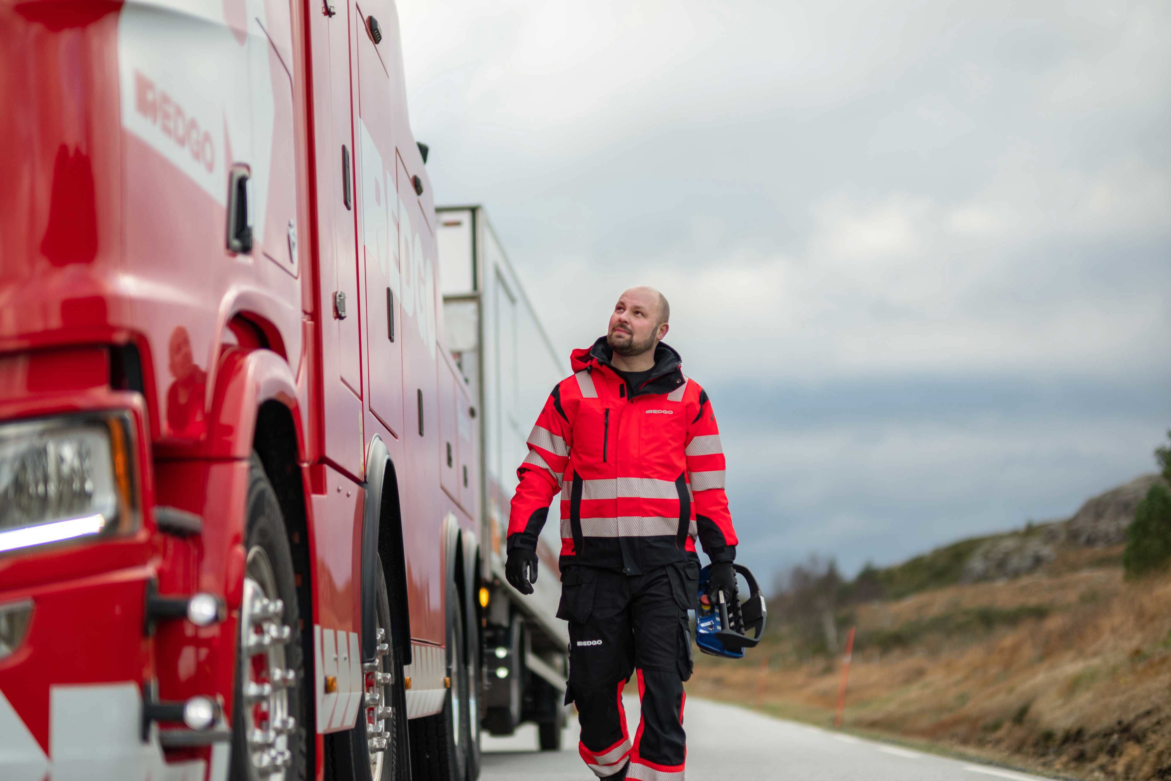 RedGo employee looking at RedGo van.